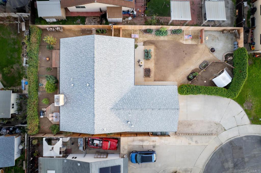 1467 Ronda Place Escondido, CA 92027 - Photo 26 of 26 an aerial view of a house with a yard and large tree