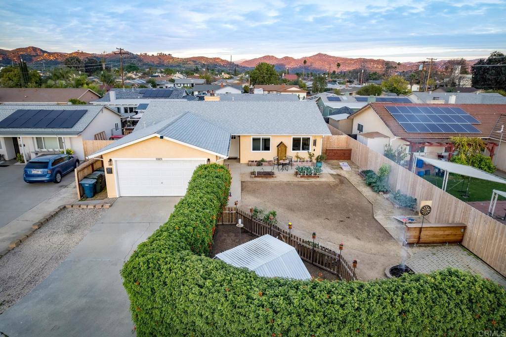 1467 Ronda Place Escondido, CA 92027 - Photo 3 of 26 an aerial view of a house with a yard and lake view