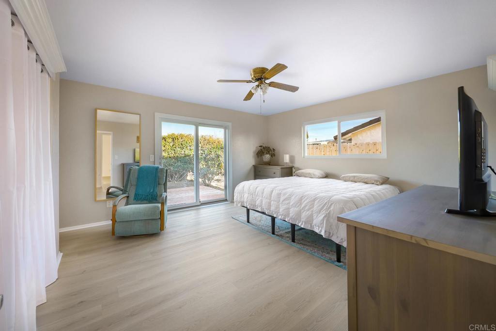 1467 Ronda Place Escondido, CA 92027 - Photo 8 of 26 a bedroom with a bed and glass couch