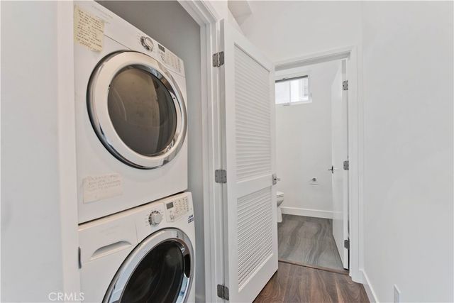 a view of a hallway with washer and dryer