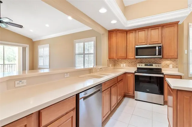 a kitchen with a refrigerator a sink and dishwasher