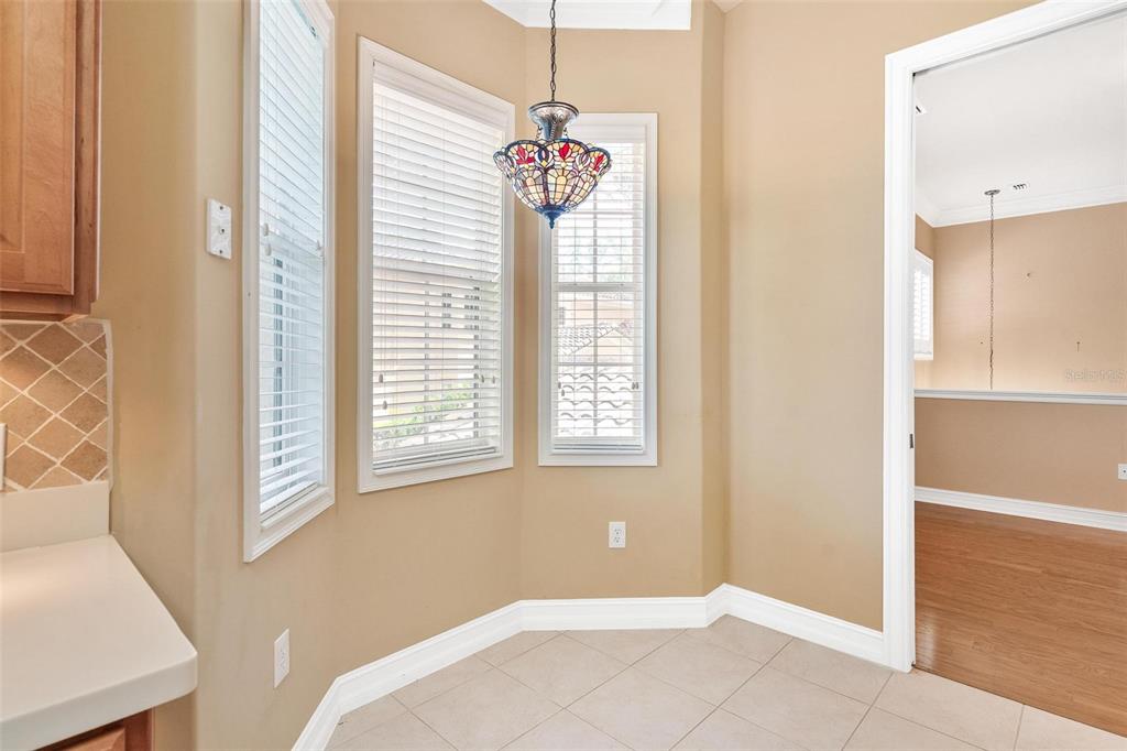 14 Camino Real, Unit 14 Howey-in-the-Hills, FL 34737 - Photo 14 of 62 a bedroom with windows and entrance