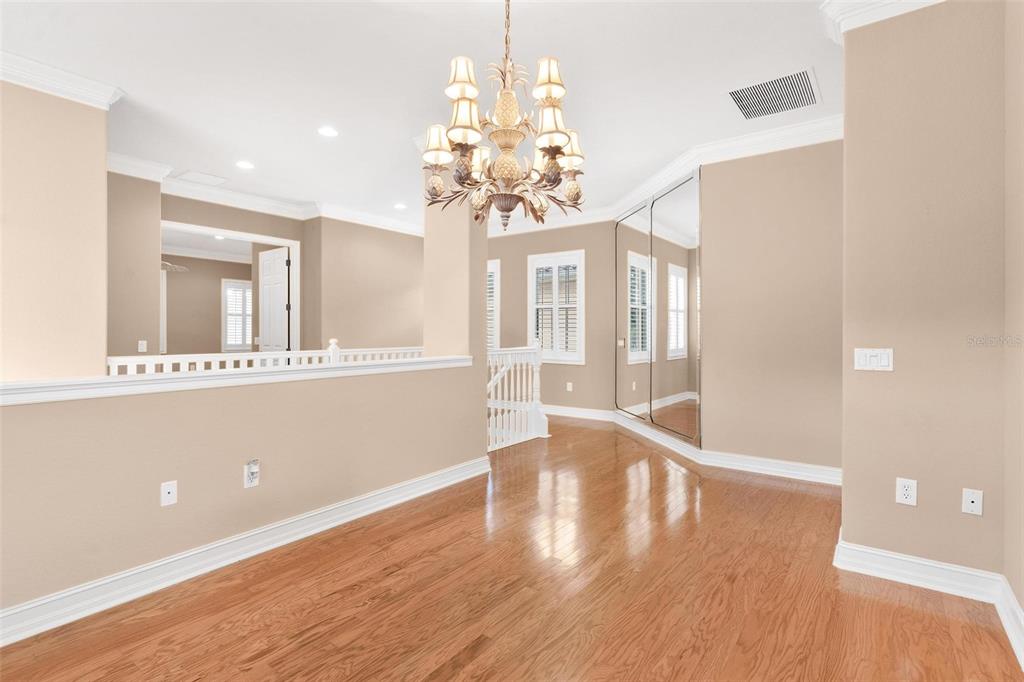 14 Camino Real, Unit 14 Howey-in-the-Hills, FL 34737 - Photo 18 of 62 a view of an entryway with wooden floor