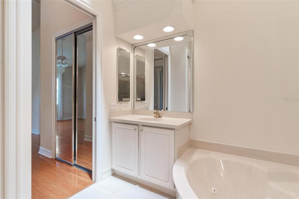 14 Camino Real, Unit 14 Howey-in-the-Hills, FL 34737 - Photo 27 of 62 a bathroom with a bathtub and a sink