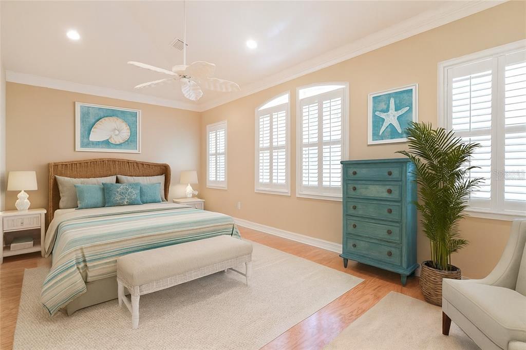 14 Camino Real, Unit 14 Howey-in-the-Hills, FL 34737 - Photo 30 of 62 a spacious bedroom with a bed and a window