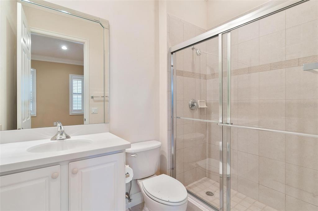14 Camino Real, Unit 14 Howey-in-the-Hills, FL 34737 - Photo 32 of 62 a bathroom with a sink a toilet and shower