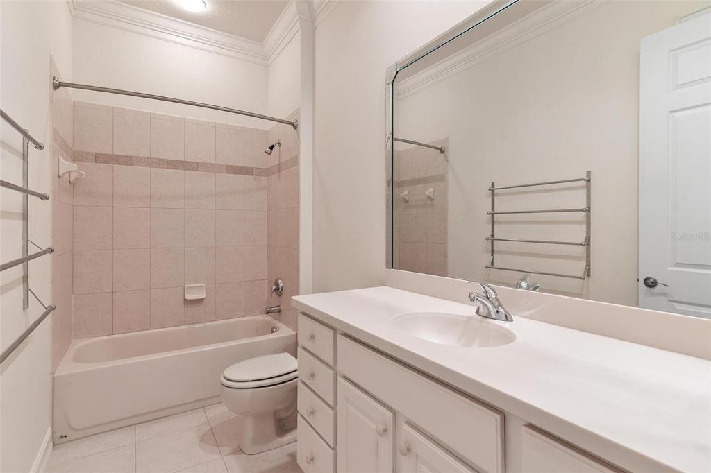 14 Camino Real, Unit 14 Howey-in-the-Hills, FL 34737 - Photo 33 of 62 a bathroom with a sink a toilet and shower
