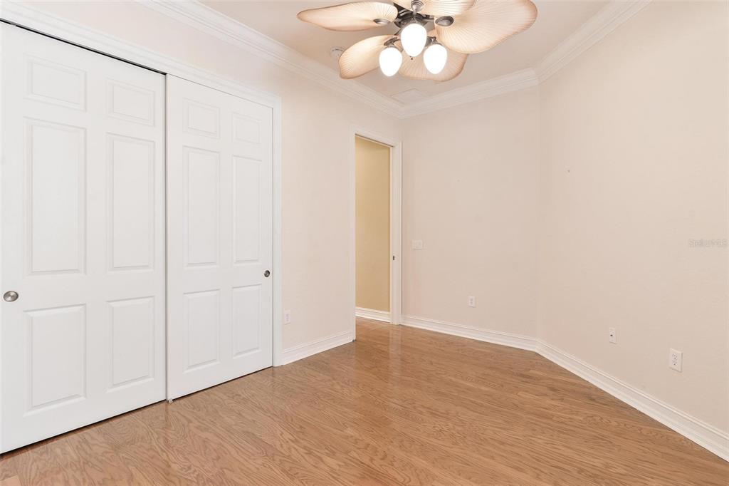 14 Camino Real, Unit 14 Howey-in-the-Hills, FL 34737 - Photo 35 of 62 an empty room with wooden floor and windows
