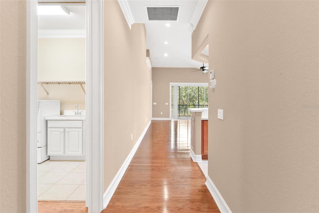 14 Camino Real, Unit 14 Howey-in-the-Hills, FL 34737 - Photo 43 of 62 a view of a hallway with wooden floor and entryway