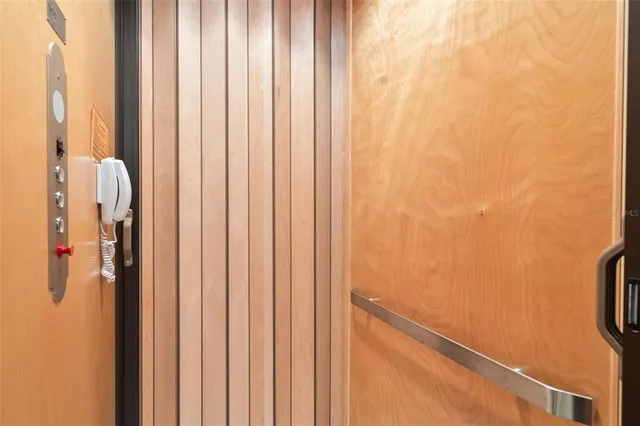 an aerial view of a house with outdoor space swimming pool and lake view