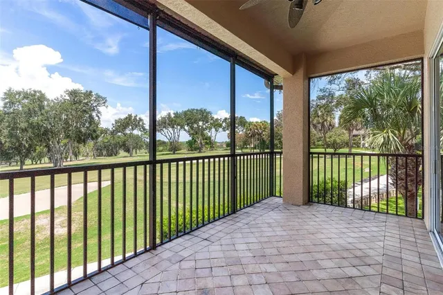 an aerial view of a houses with outdoor space swimming pool