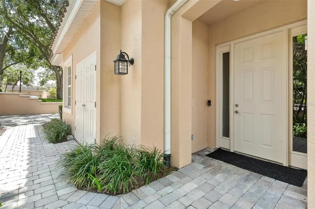 an aerial view of residential houses with outdoor space and swimming pool