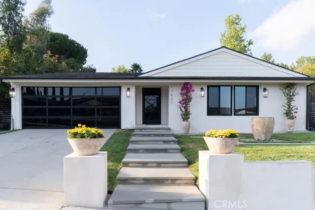a front view of a house with seating space