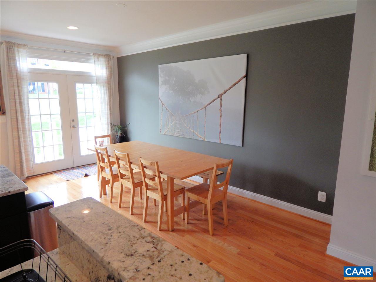 2055 Avinity Loop Charlottesville, VA 22902 - Photo 11 of 28 a view of a dining room with furniture and wooden floor