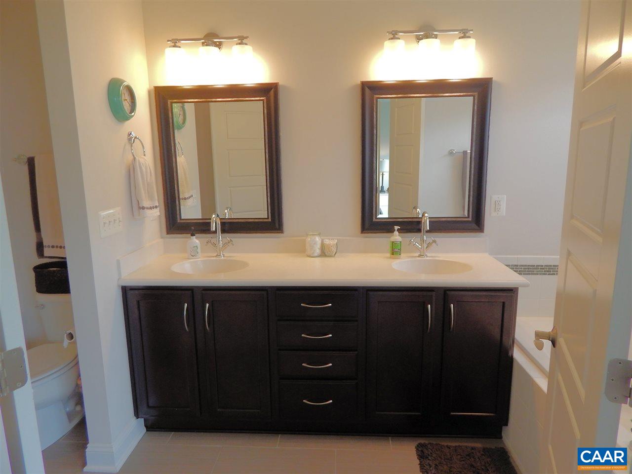 2055 Avinity Loop Charlottesville, VA 22902 - Photo 18 of 28 a bathroom with a double vanity sink and mirror