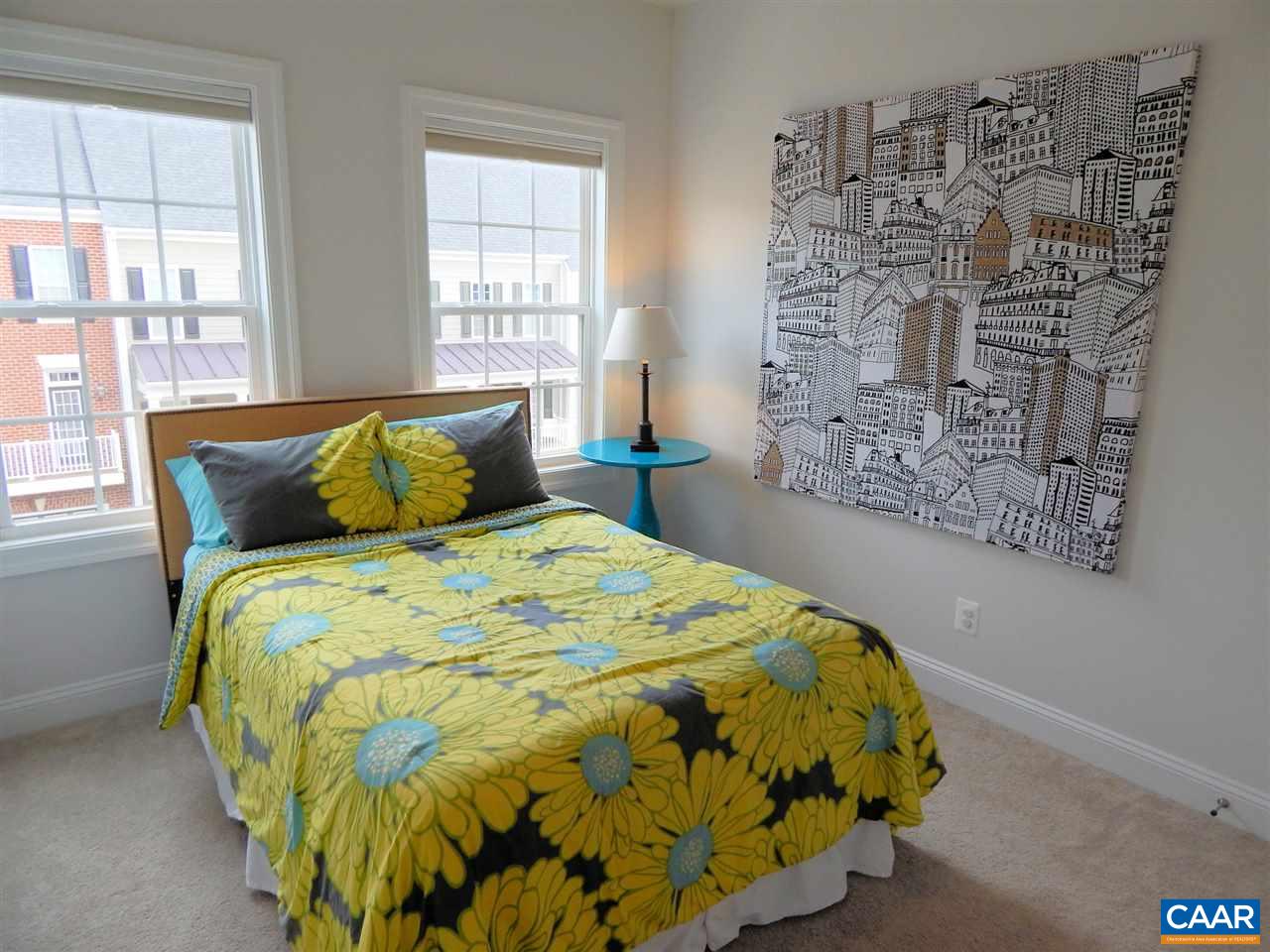 2055 Avinity Loop Charlottesville, VA 22902 - Photo 23 of 28 a bed sitting in a bedroom next to a window