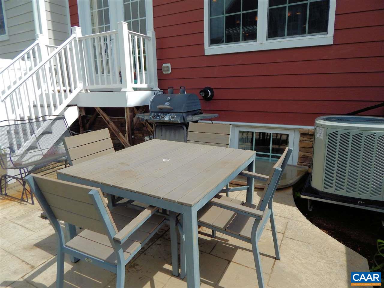 2055 Avinity Loop Charlottesville, VA 22902 - Photo 27 of 28 a view of a patio with table and chairs with wooden floor and fence