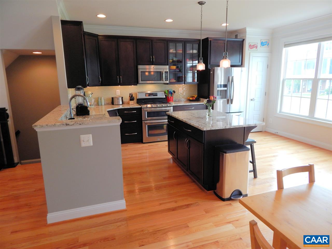 2055 Avinity Loop Charlottesville, VA 22902 - Photo 7 of 28 a kitchen with stainless steel appliances granite countertop a refrigerator a stove a sink and a microwave