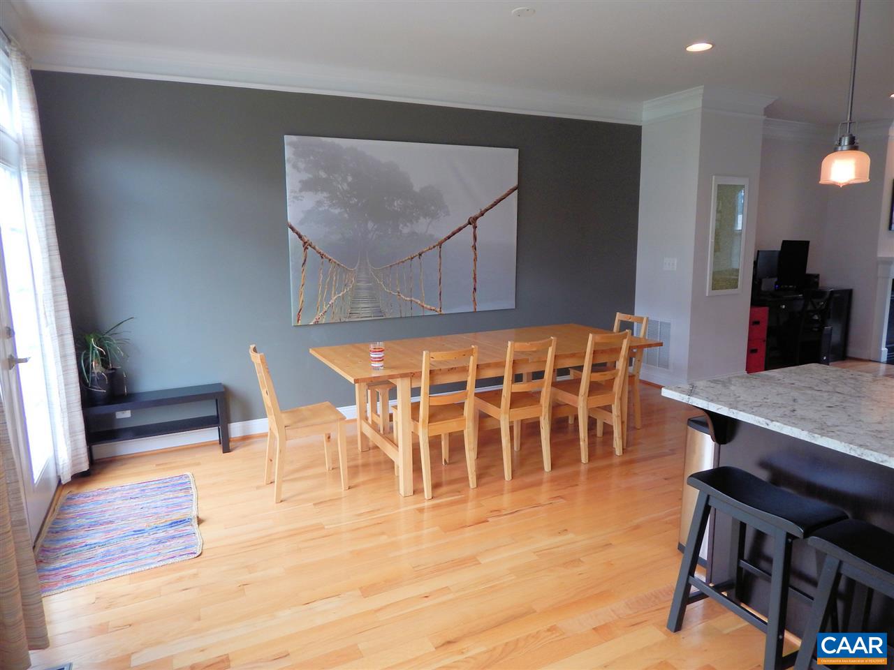 2055 Avinity Loop Charlottesville, VA 22902 - Photo 10 of 28 a view of a dining room with furniture and wooden floor