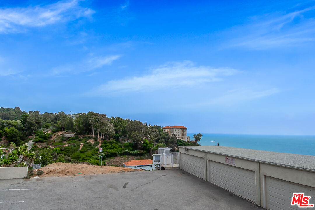 18057 Coastline Drive, Unit 5 Malibu, CA 90265 - Photo 16 of 20 a view of a terrace with skyline