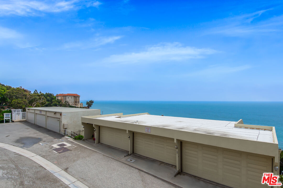 18057 Coastline Drive, Unit 5 Malibu, CA 90265 - Photo 18 of 20 a view of a terrace with skyline