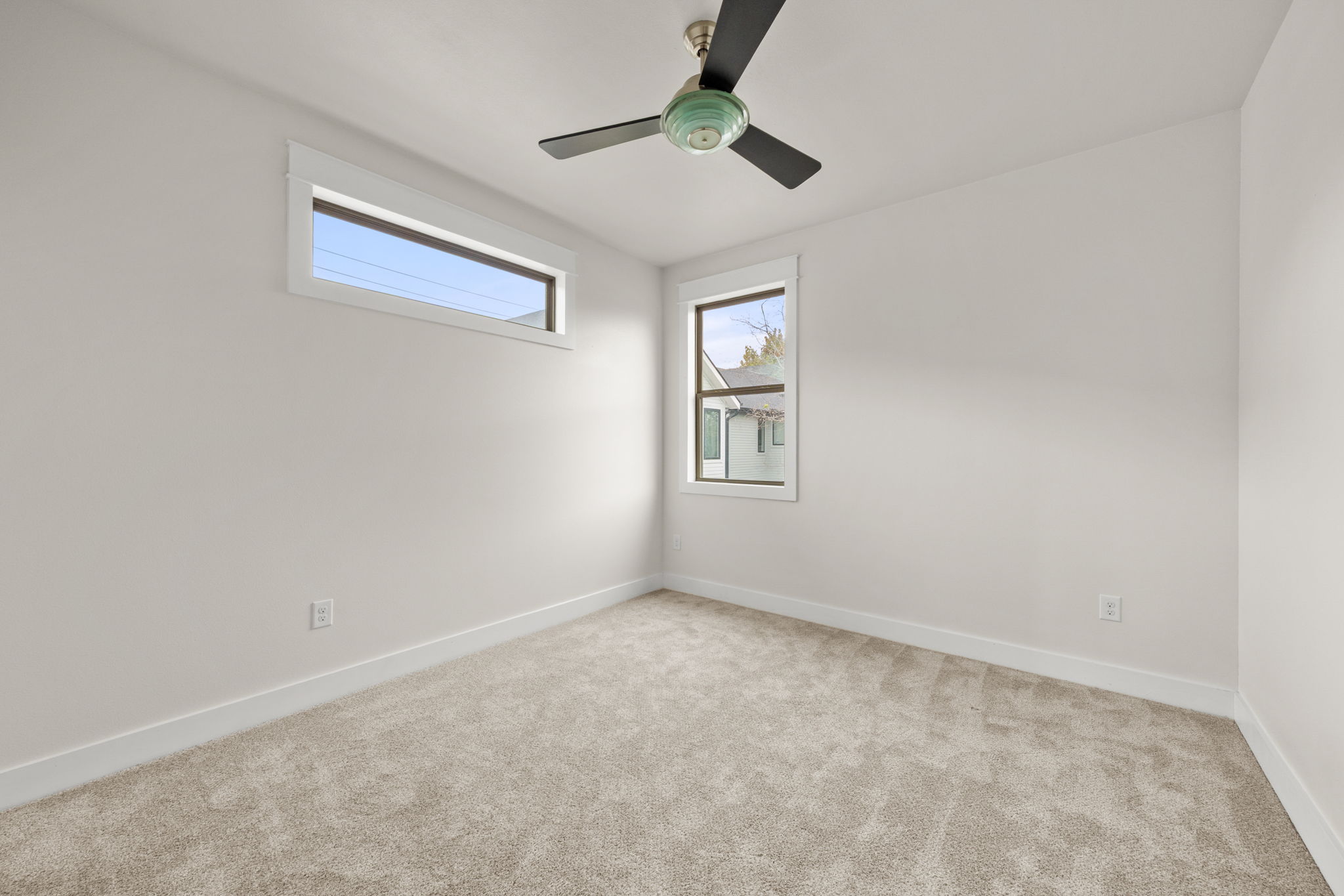 1160 Nickols Avenue, Unit A Austin, TX 78721 - Photo 17 of 40 Empty room featuring light colored carpet and a ceiling fan