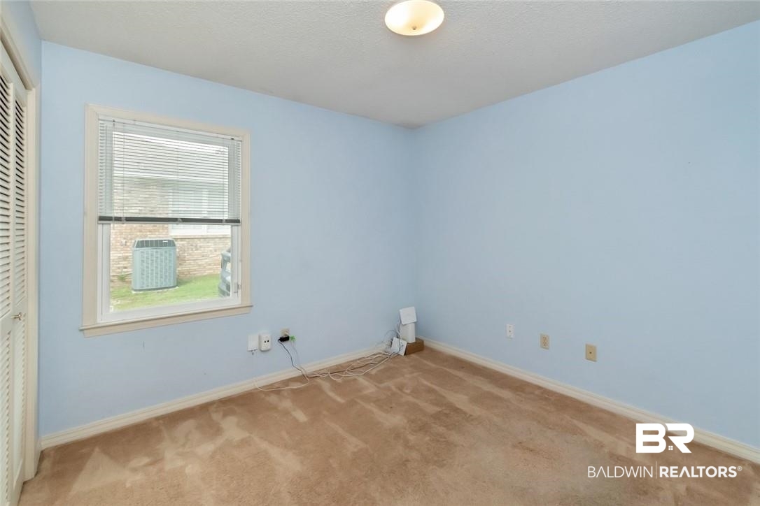 6109 Timberly Road North Mobile, AL 36609 - Photo 21 of 26 Empty room featuring light carpet