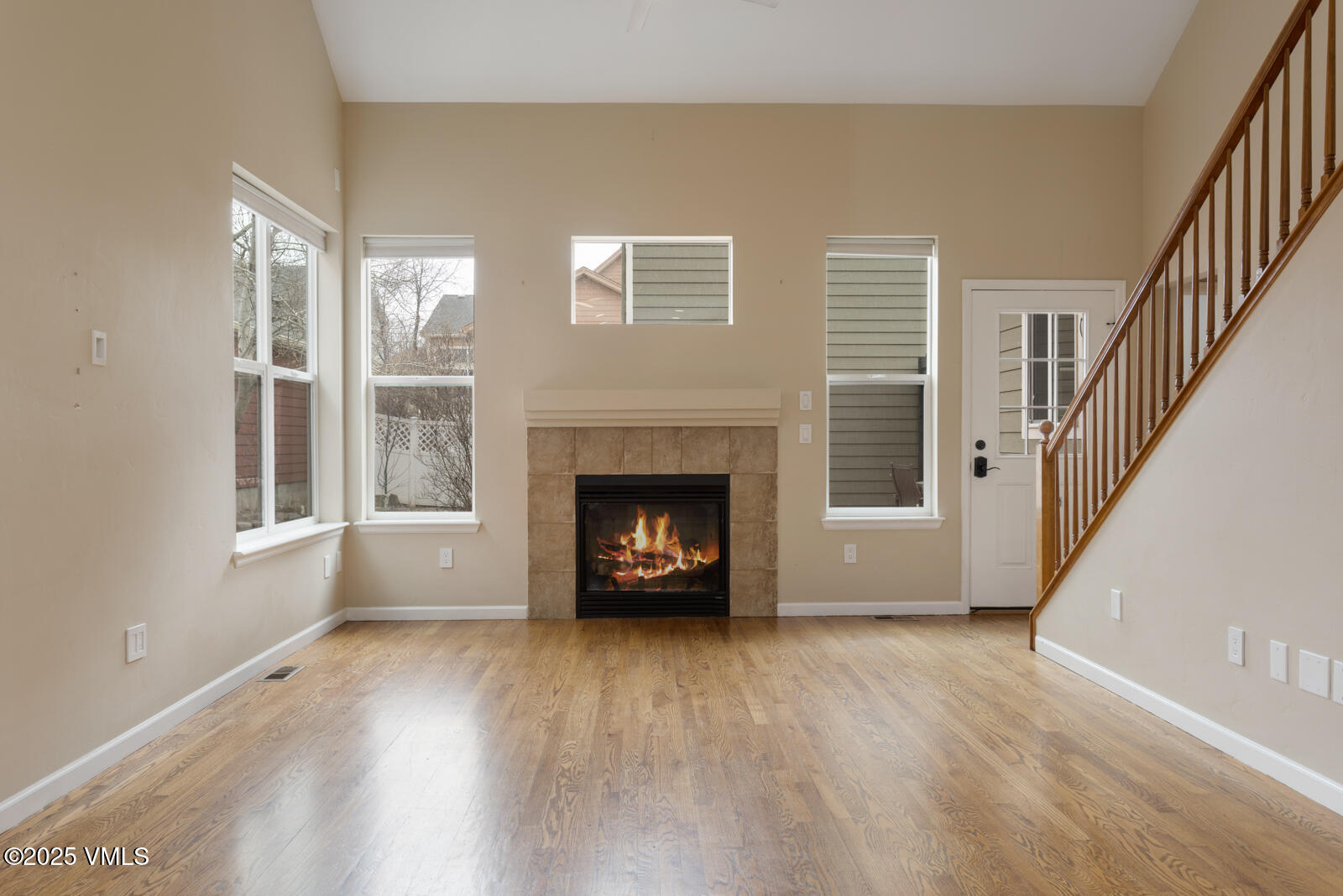 260 Longview Avenue Eagle, CO 81631 - Photo 2 of 34 a view of an empty room with wooden floor fireplace and a window