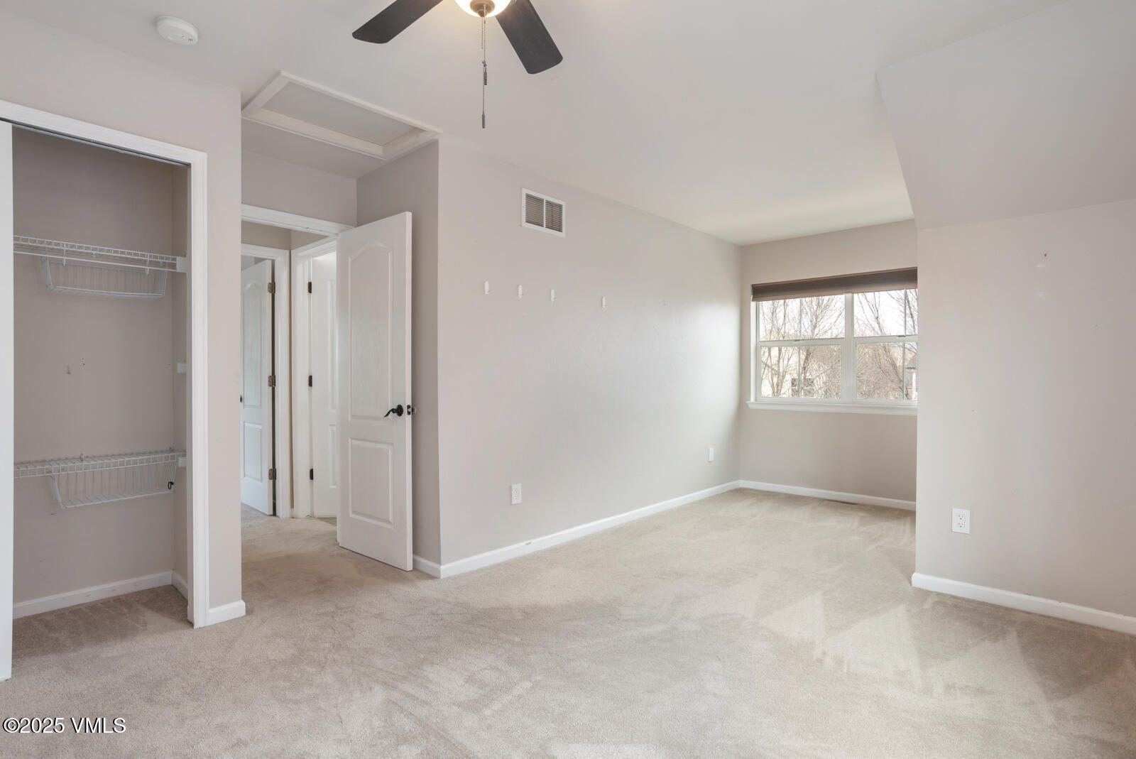 260 Longview Avenue Eagle, CO 81631 - Photo 28 of 34 an empty room with chandelier fan and windows
