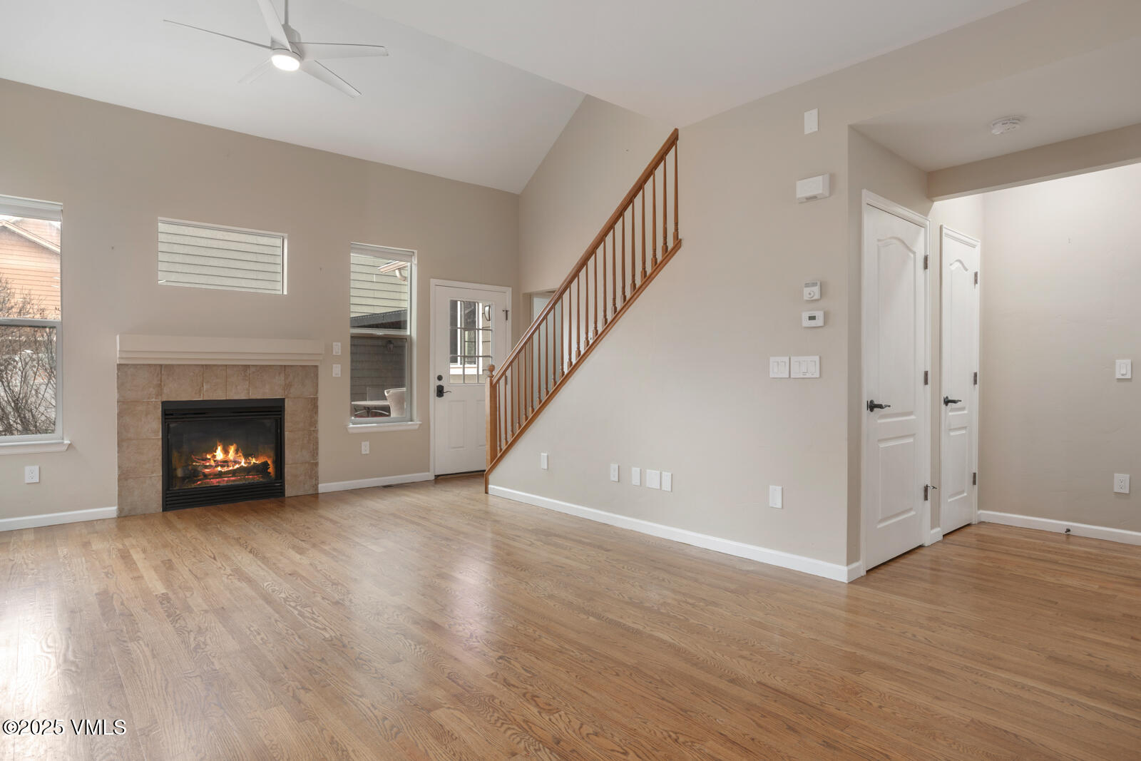 260 Longview Avenue Eagle, CO 81631 - Photo 4 of 34 a view of an empty room with wooden floor fireplace and a window