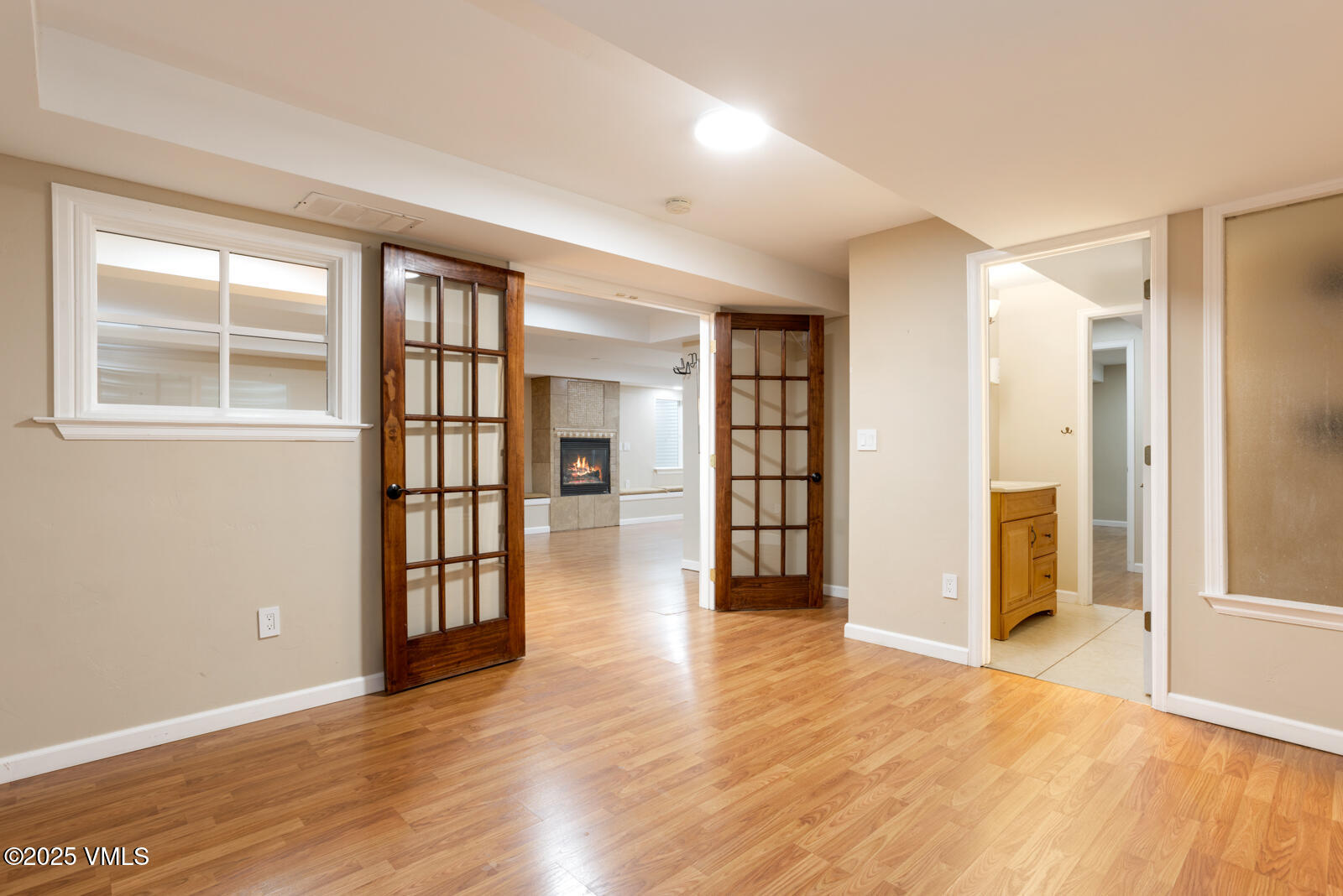 260 Longview Avenue Eagle, CO 81631 - Photo 10 of 34 an empty room with wooden floor and windows