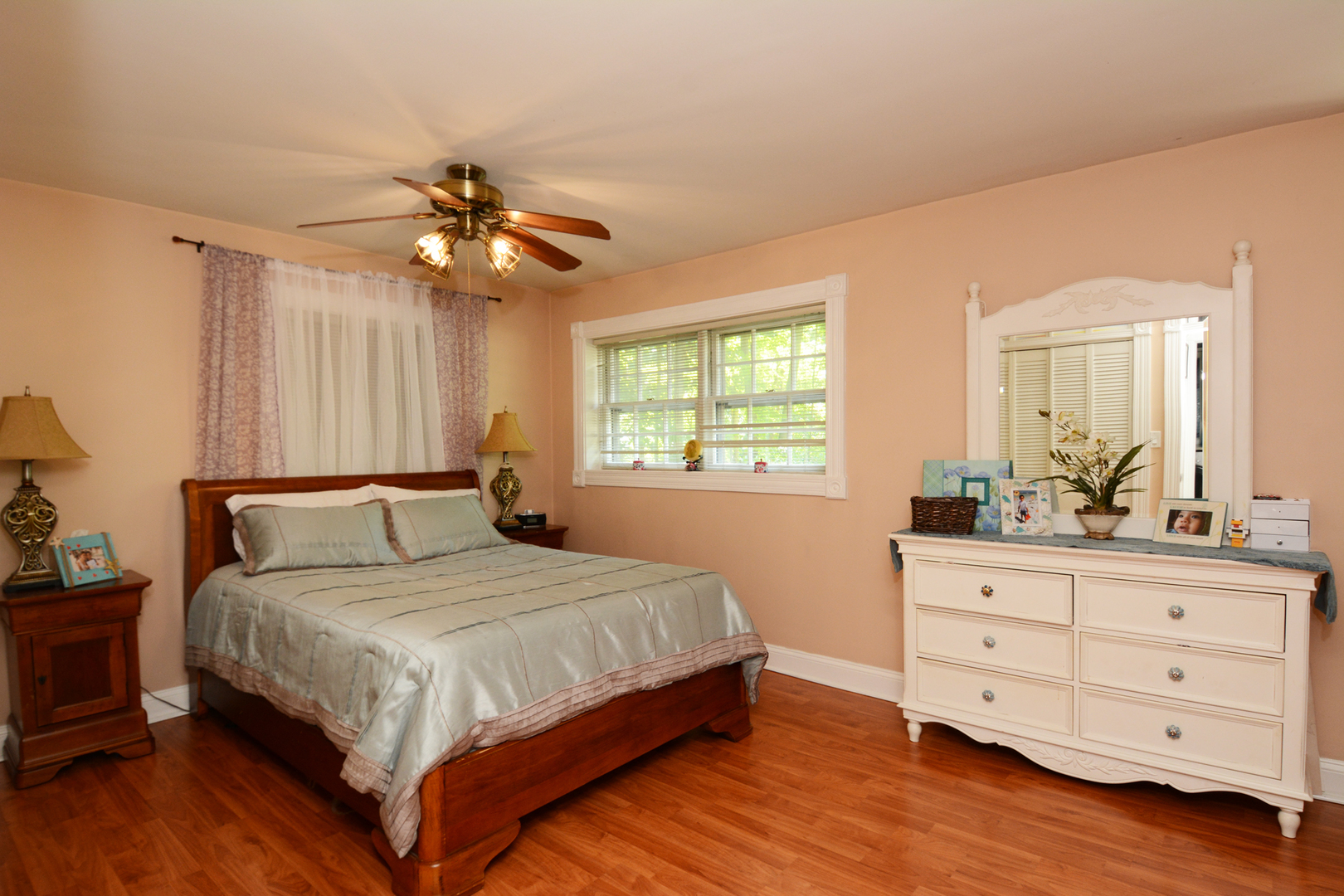 4N150 Thorntree Road St. Charles, IL 60174 - Photo 14 of 29 a bedroom with a large bed and a dresser