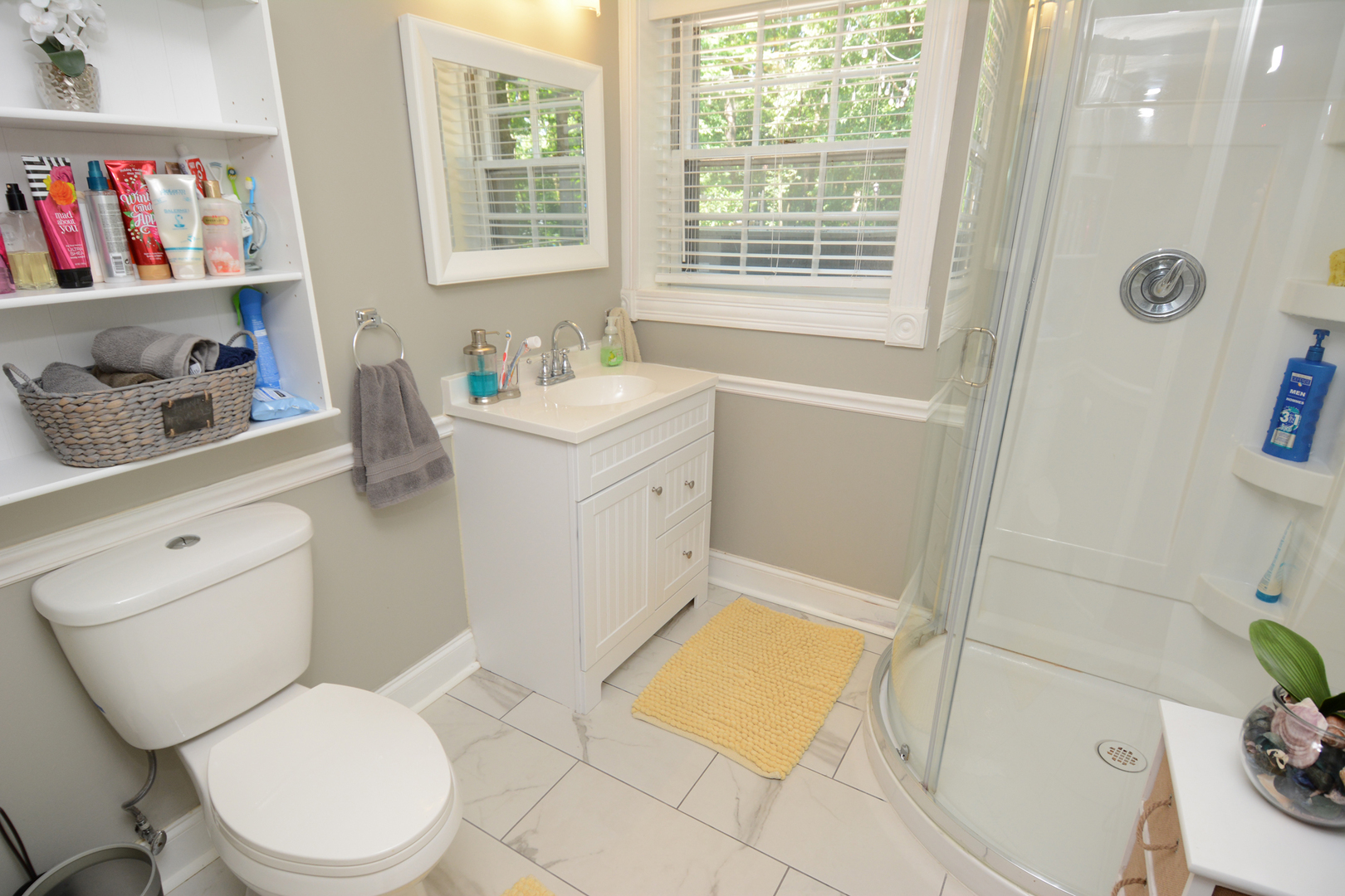 4N150 Thorntree Road St. Charles, IL 60174 - Photo 15 of 29 a white toilet sitting next to a bathroom sink and tub