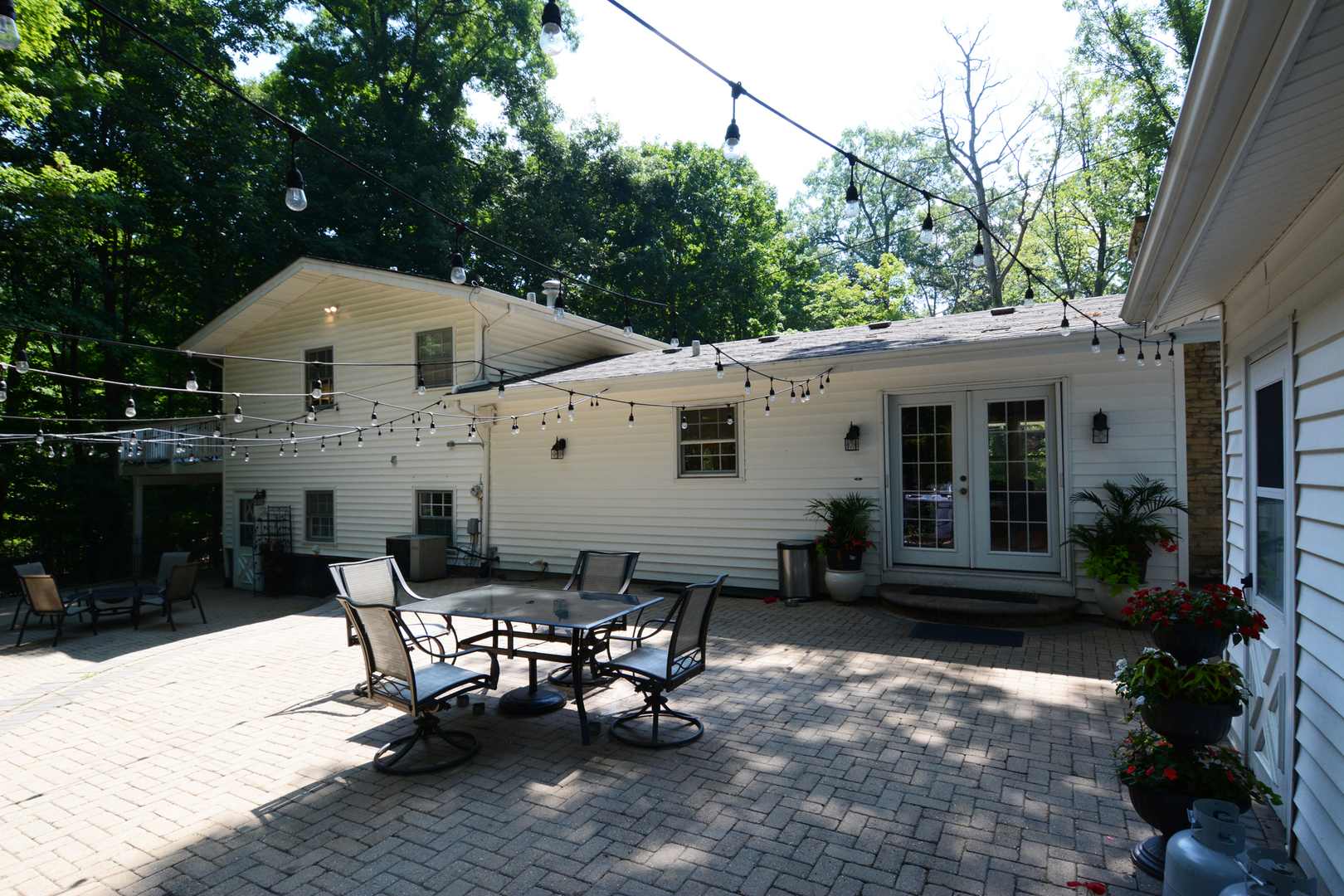 4N150 Thorntree Road St. Charles, IL 60174 - Photo 25 of 29 a roof deck with table and chairs potted plants and a large tree
