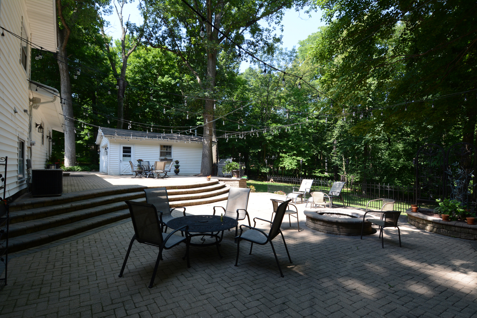 4N150 Thorntree Road St. Charles, IL 60174 - Photo 26 of 29 a view of a patio with a table and chairs and couches