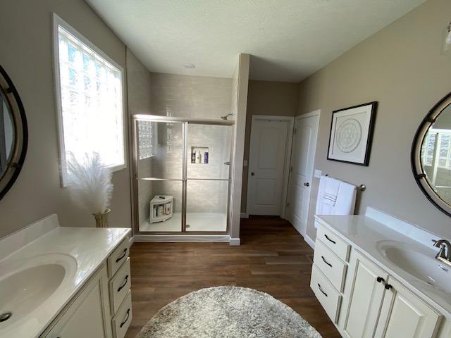 2060 Allensville Road Bennington, IN 47011 - Photo 12 of 34 Master Bath with separate double bowl vanities, oversized shower, and glass block window