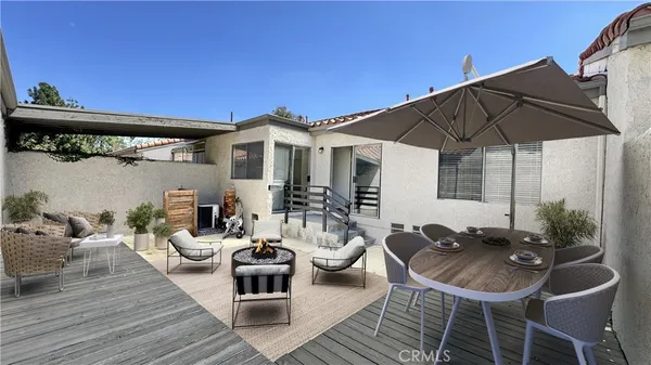 a view of a house with wooden deck