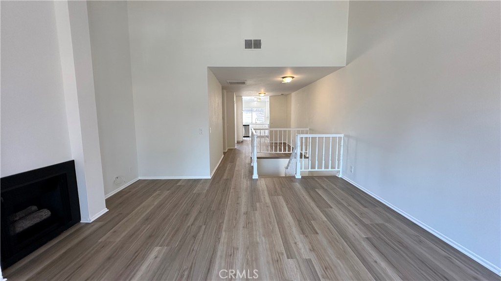 19519 Rinaldi Street, Unit 57 Porter Ranch, CA 91326 - Photo 13 of 28 a view of empty room with wooden floor