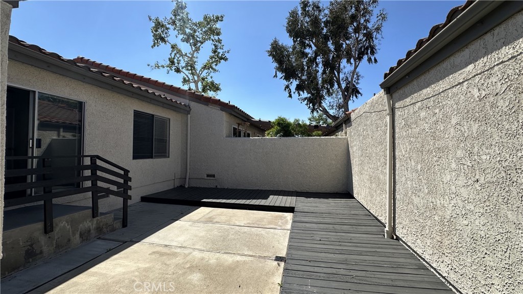19519 Rinaldi Street, Unit 57 Porter Ranch, CA 91326 - Photo 14 of 28 a view of a house with a backyard