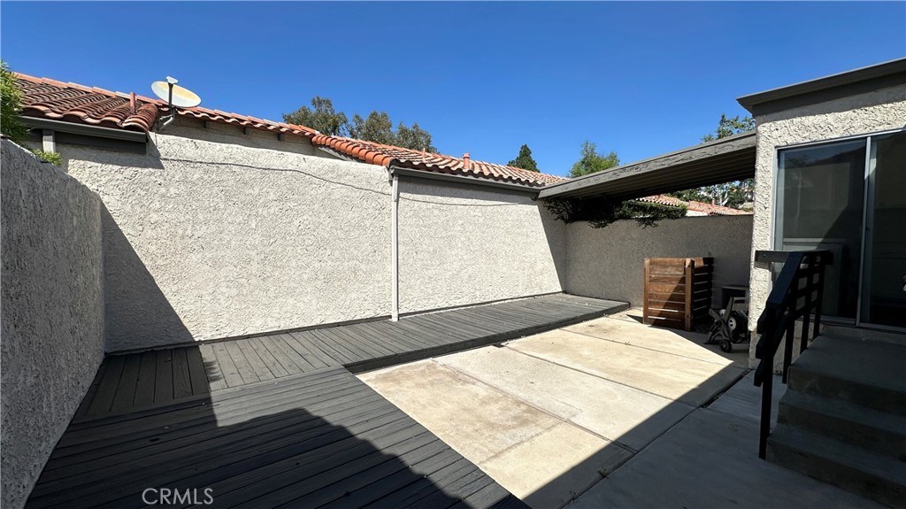 19519 Rinaldi Street, Unit 57 Porter Ranch, CA 91326 - Photo 15 of 28 a view of a balcony with wooden floor and seating space