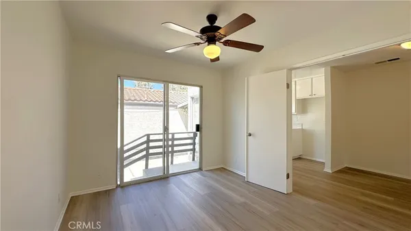 a bathroom with a sink a toilet a mirror and shower