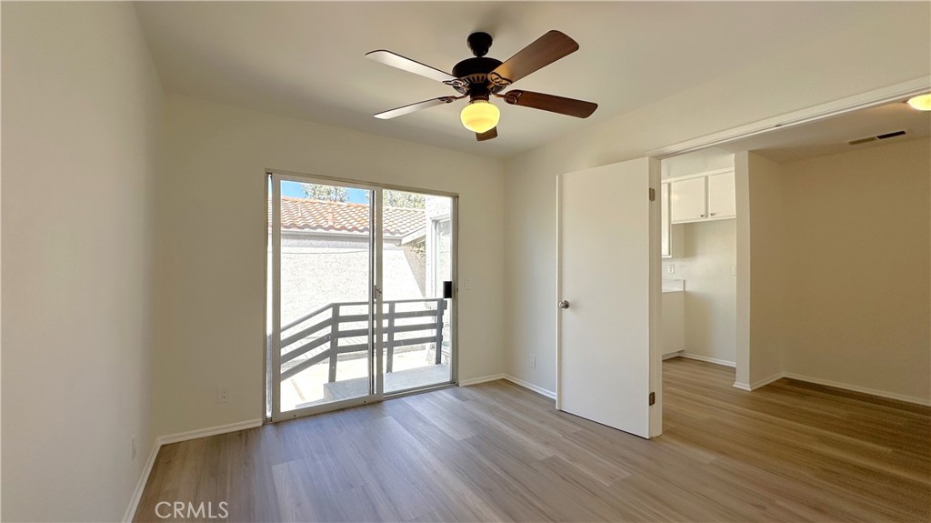 19519 Rinaldi Street, Unit 57 Porter Ranch, CA 91326 - Photo 16 of 28 wooden floor in an empty room with a window
