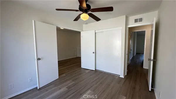 a view of a balcony with two chairs and a table