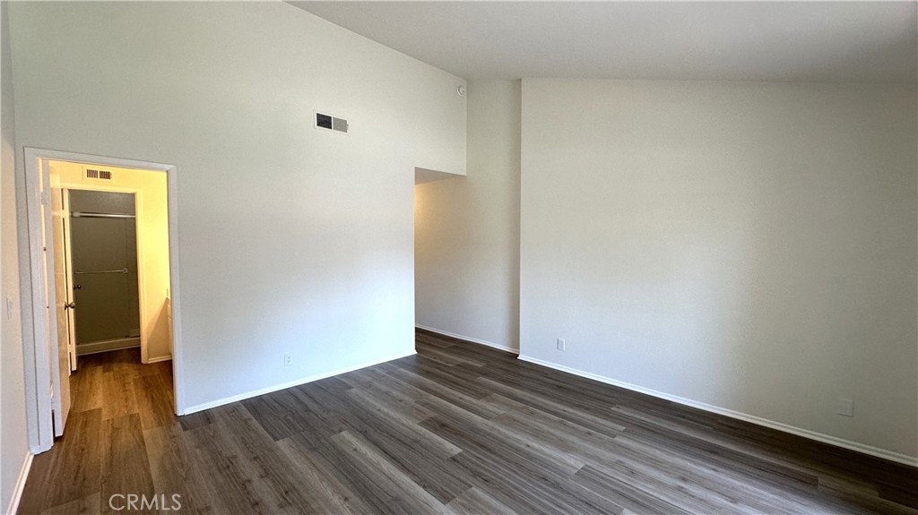 19519 Rinaldi Street, Unit 57 Porter Ranch, CA 91326 - Photo 18 of 28 a view of an empty room with wooden floor