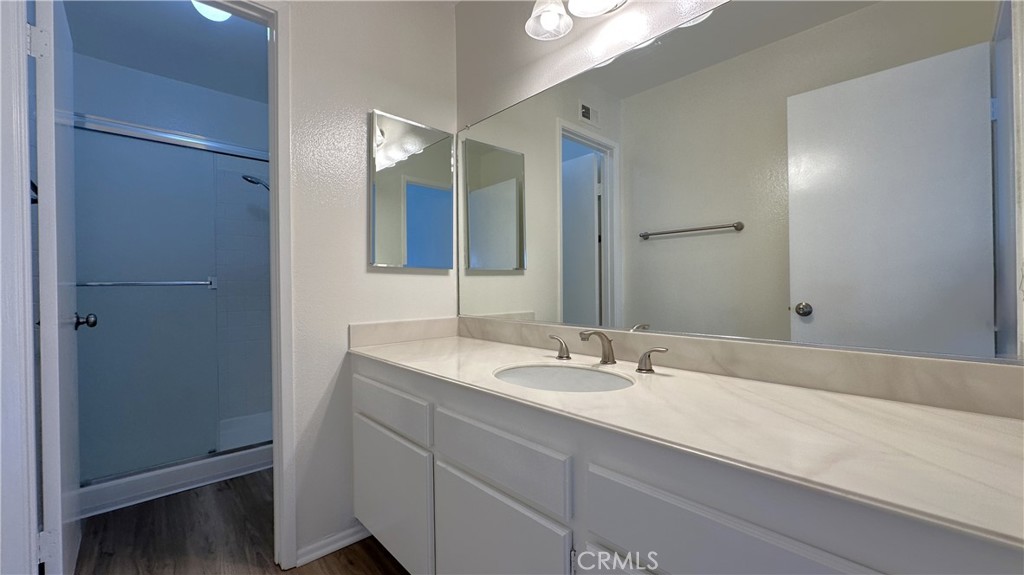 19519 Rinaldi Street, Unit 57 Porter Ranch, CA 91326 - Photo 20 of 28 a bathroom with a sink and a mirror