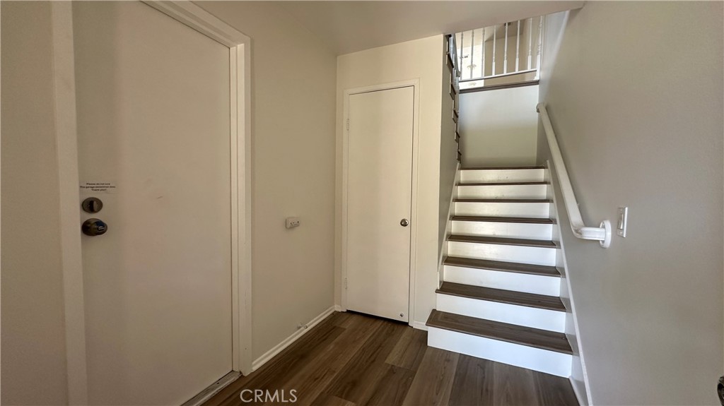 19519 Rinaldi Street, Unit 57 Porter Ranch, CA 91326 - Photo 26 of 28 a view of entryway with wooden floor