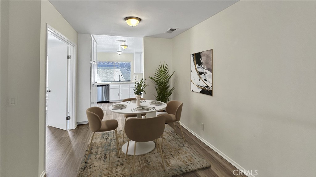 19519 Rinaldi Street, Unit 57 Porter Ranch, CA 91326 - Photo 5 of 28 a view of a dining room with furniture