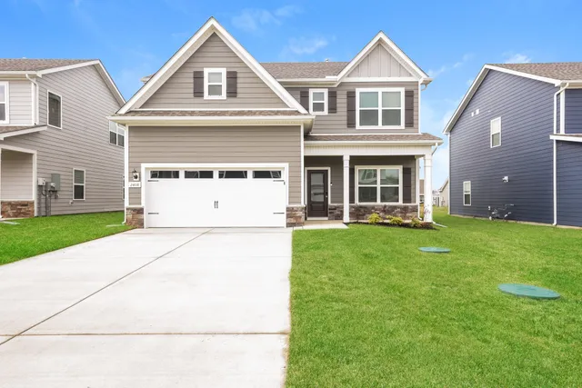 a view of house with yard and entertaining space
