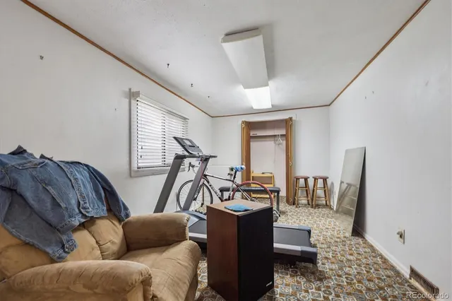 a view of a livingroom with furniture and windows