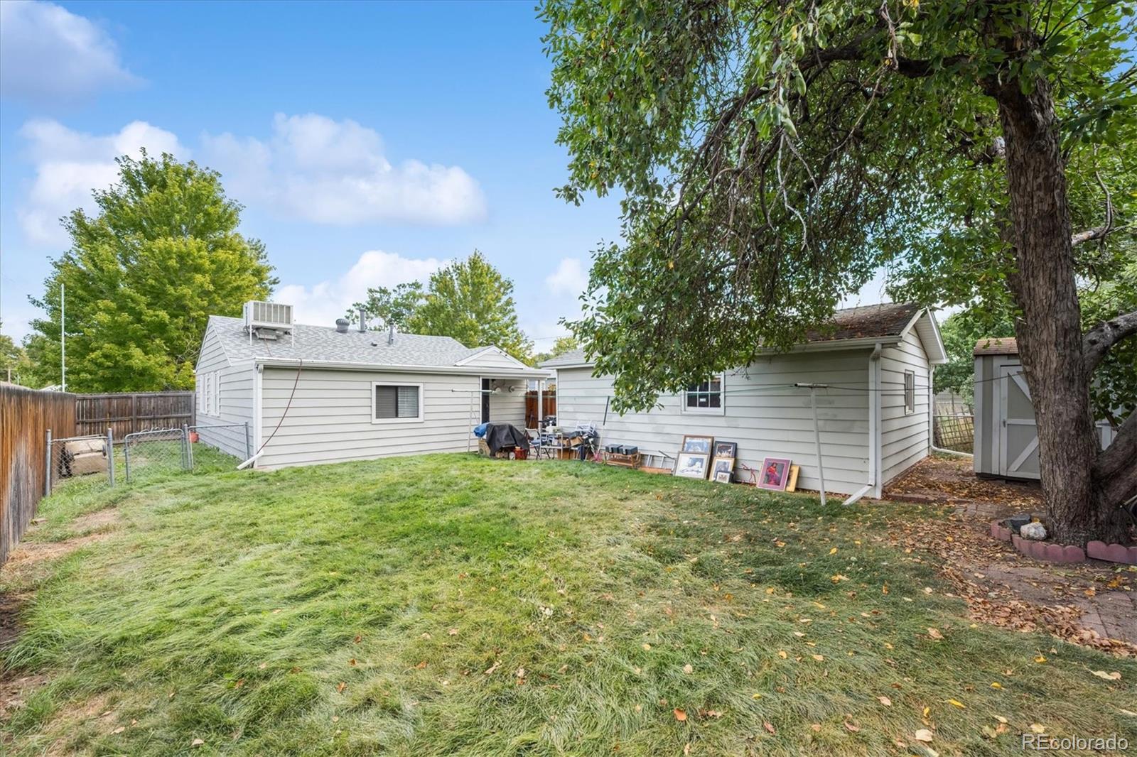 5465 Reed Court Arvada, CO 80002 - Photo 23 of 27 a house with trees in the background